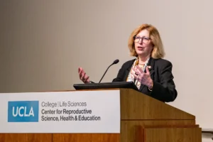 Teresa Woodruff speaking at a podium
