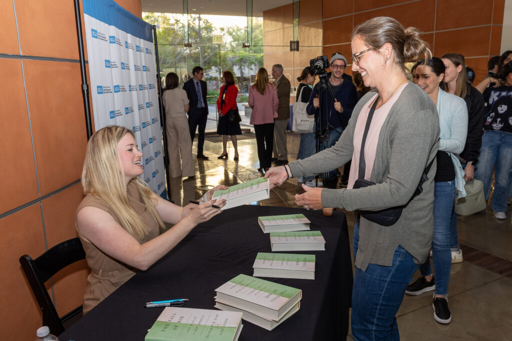 Elizabeth Dias, New York Times National Religion Correspondent, signs books at a CRSHE Distinguished Speaker Series event.