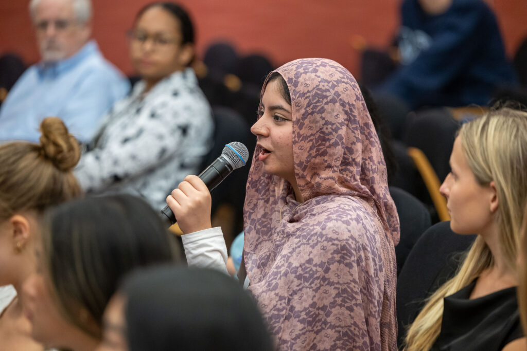 Audience member asks a question at a Distinguished Speaker Series event.