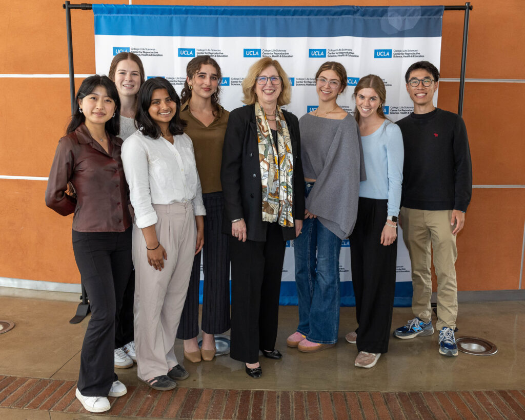 Group photo of Dr. Teresa Woodruff and attendees at the CRSHE Distinguished Speaker Series event on oncofertility.